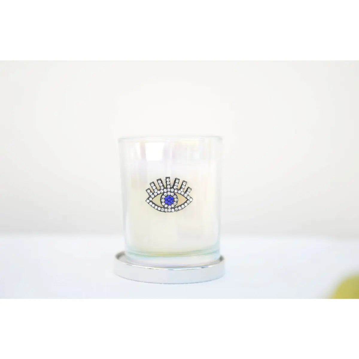 Bougie argent œil parfum patchouli AULICA