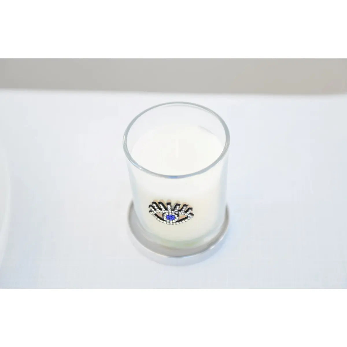 Bougie argent œil parfum patchouli AULICA