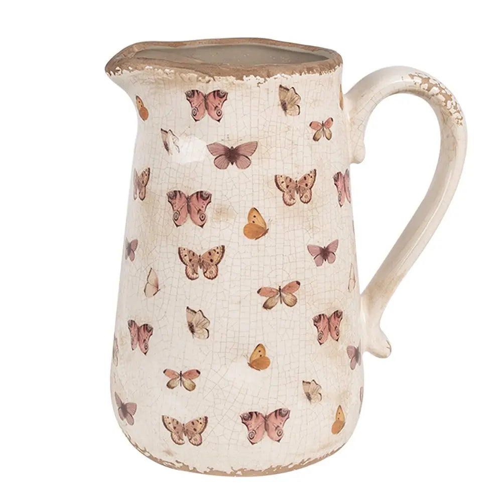 La décoration peut être de 21x15x23 cm de papillons en céramique rose beige verser la cruche Clayre & Eef.