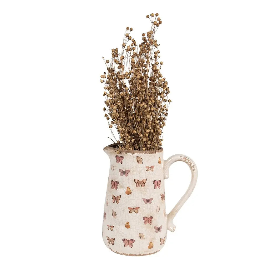 La décoration peut être de 21x15x23 cm de papillons en céramique rose beige verser la cruche Clayre & Eef.